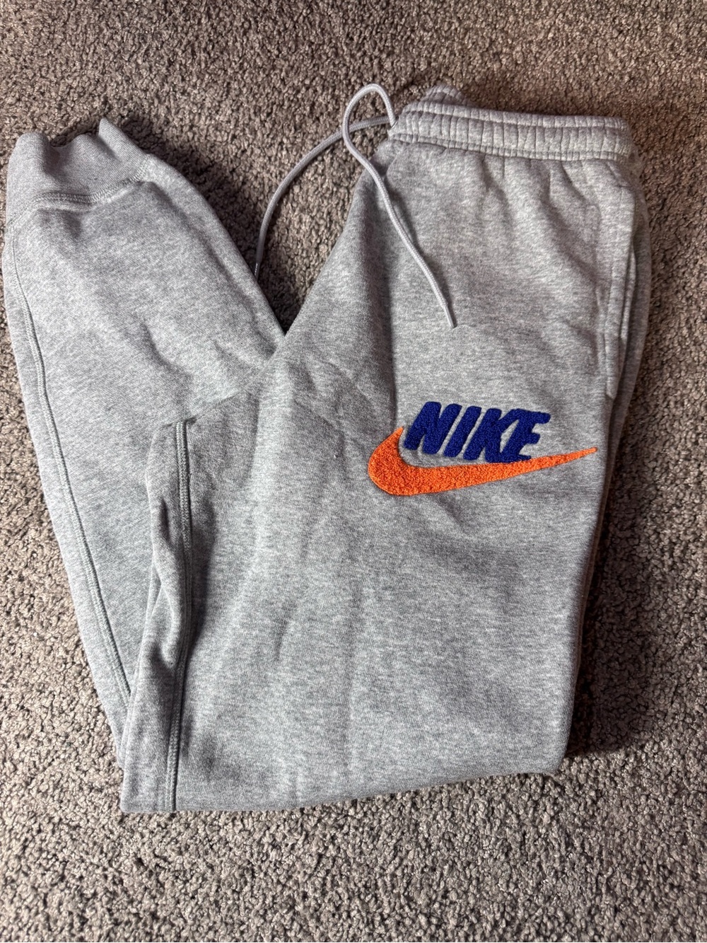 Nike Men’s Gray Sweatpants with Blue Logo and Orange Swoosh